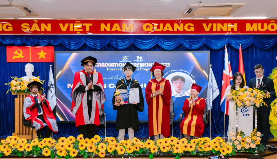 A group of people in graduation gowns and caps

Description automatically generated